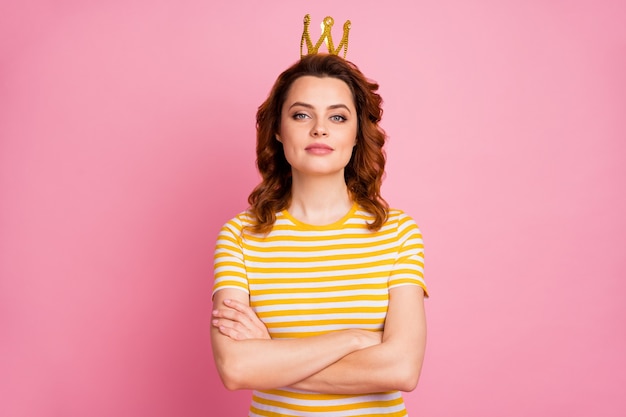 portrait of arrogant content girl folded arms wearing diamond crown