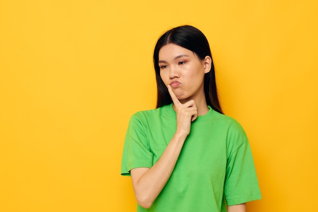 Portrait Asian beautiful young woman in green tshirts gestures with his hands emotions Lifestyle unaltered