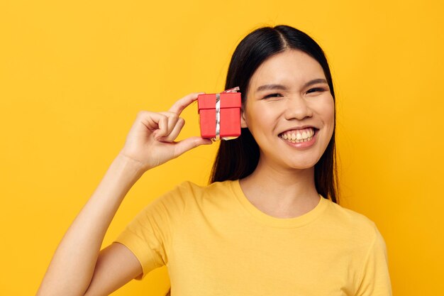 Portrait asian beautiful young woman little red gift box fun isolated background unaltered person