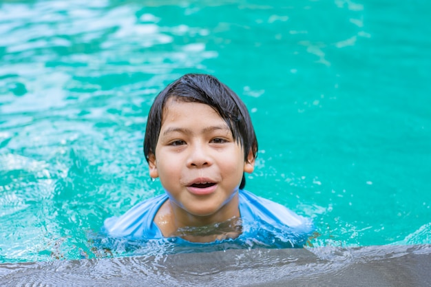 Portrait of Asian boy in swimming pool