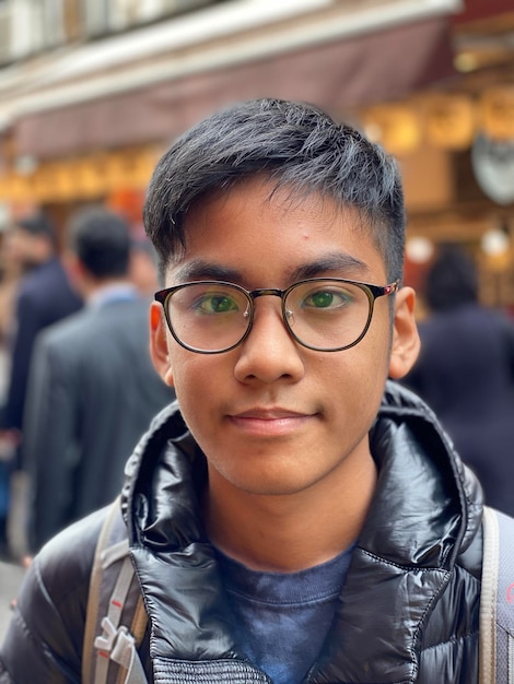 portrait of an asian boy wearing eyeglasses