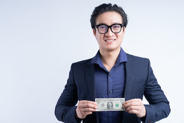 Portrait of asian businessman holding one dollar