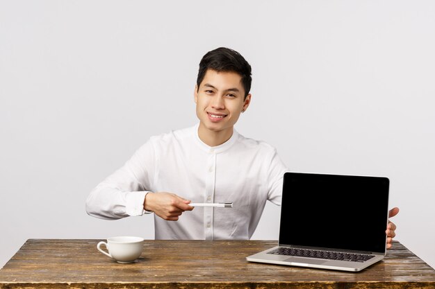 Portrait Asian businessman with laptop