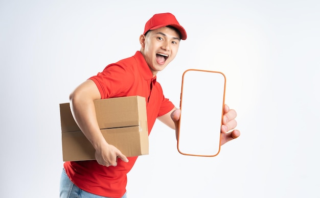 Portrait of asian delivery man on white background