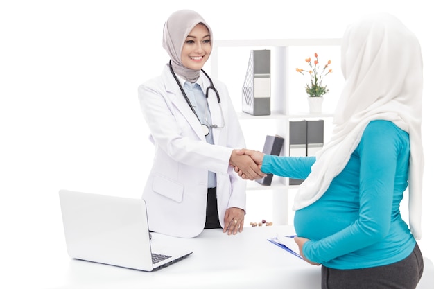 Portrait of asian female obstetrician with her patient at office