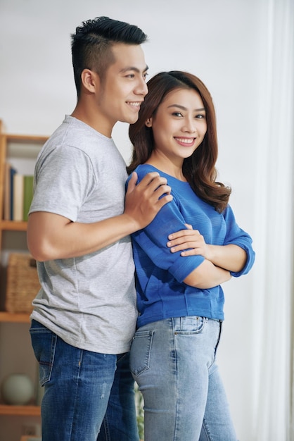 Portrait Of Asian Girl Embraced By Boyfriend