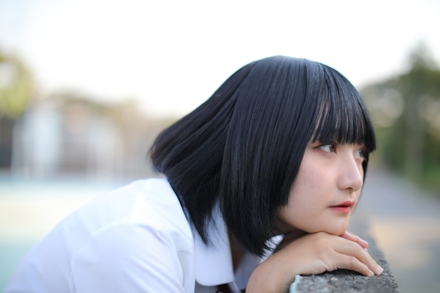 Portrait of asian girl looking at park outdoor