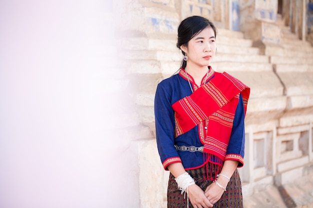 Portrait of asian girl with Thai local traditional dress famous in countryside of Thailand