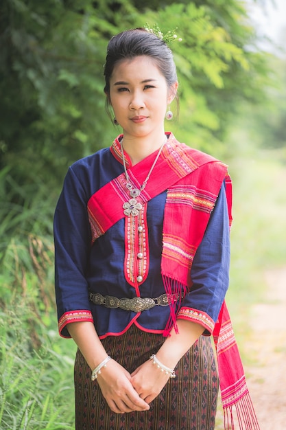 Photo portrait of asian girl with thai local traditional dress famous in countryside of thailand