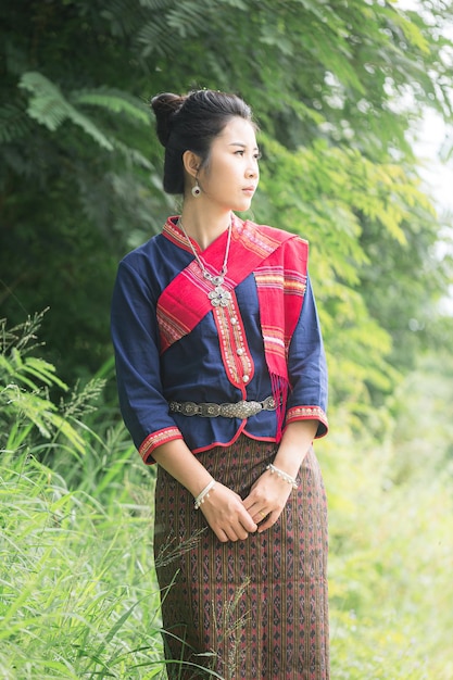 Portrait of asian girl with Thai local traditional dress famous in countryside of Thailand