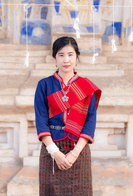 Portrait of asian girl with Thai local traditional dress famous in countryside of ThailandLadies i