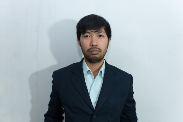 Portrait of asian handsome man messy wear suit on white backgrond