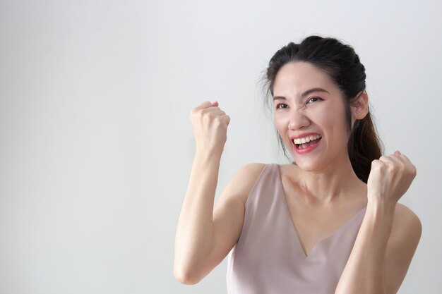 Portrait Asian happy winner women celebrate success achieve goal with smiling