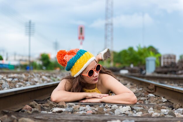 Portrait of Asian hipster girl at railwaythailand people