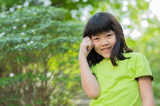 Portrait asian kid child enjoy and happy the girl is smiling thinking kid