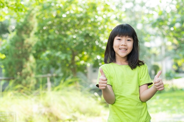 Portrait asian kid child enjoy and happy the girl is smiling