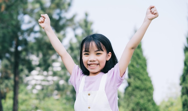 Portrait of Asian little girl playing in the park