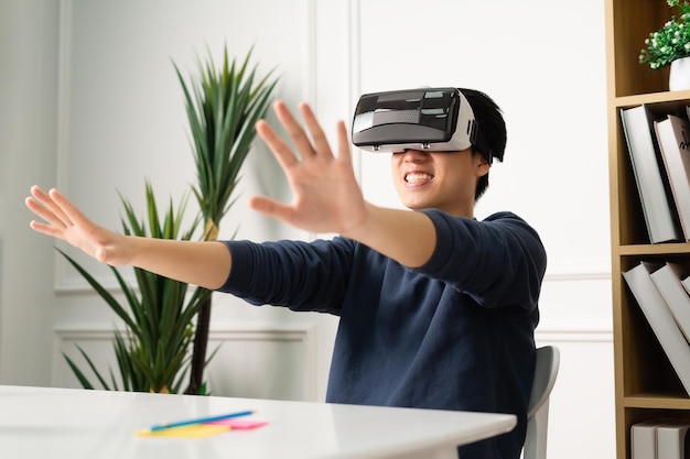 Portrait of asian man using virtual reality glasses