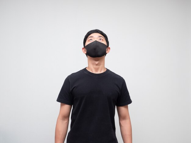 Portrait asian man with protect mask looking up to space on white background