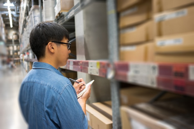 Portrait Asian men, staff, product counting Warehouse Control Manager 