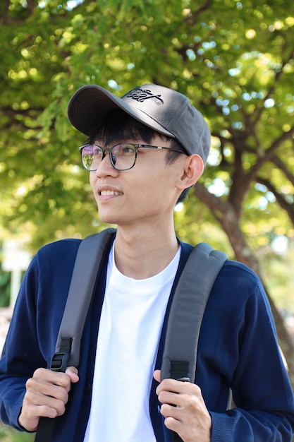 Portrait of Asian menswear wearing hat and glasses