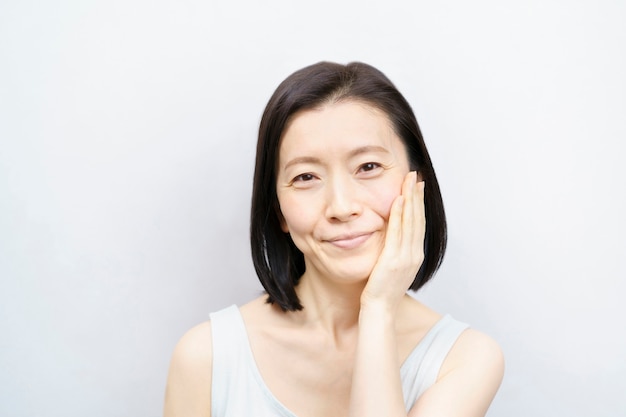 Portrait of Asian middle woman on white