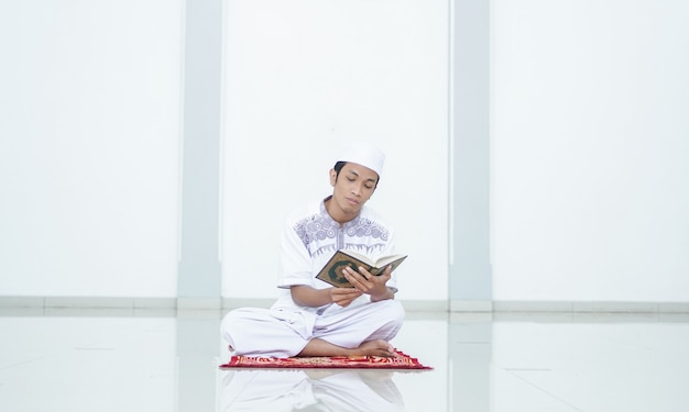 A portrait of an asian muslim man Recite at mosque