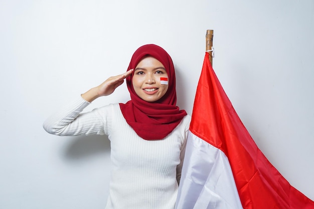 Portrait of Asian Muslim Women Celebrate Indonesian independence day holding Red and white flag