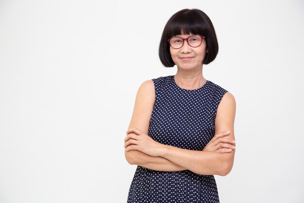 Portrait of asian senior woman with arms crossed isolated