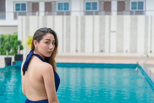 Portrait Asian sexy woman swimming at swimmingpoolthailand peoplerelax time