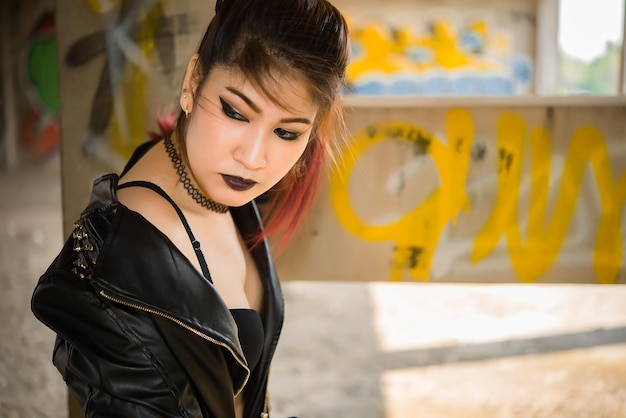 Portrait of asian with black leather dress punk styleThailand people take a picture