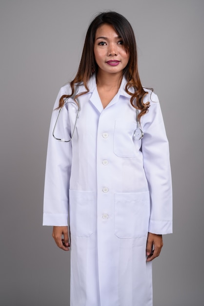 Portrait of Asian woman doctor with wavy hair