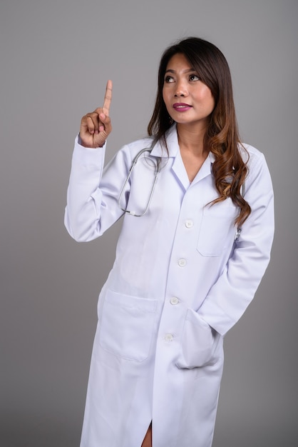 Portrait of Asian woman doctor with wavy hair