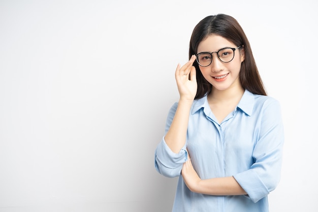 Portrait of Asian woman doing glasses