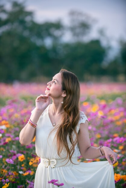 Portrait of an Asian woman in a flower garden