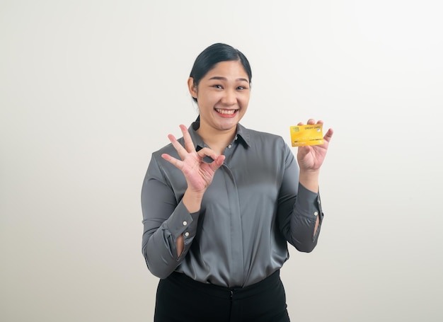 portrait Asian woman holding credit card with white background