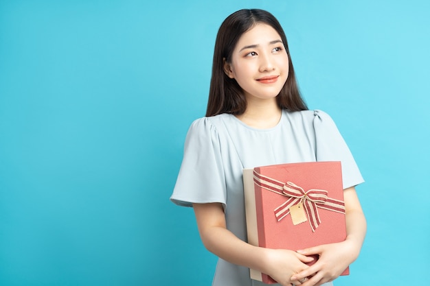 Portrait of asian woman holding gift box