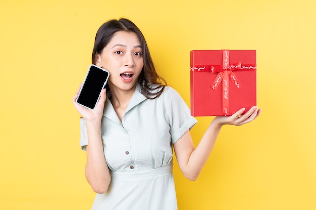 Portrait of asian woman holding gift box