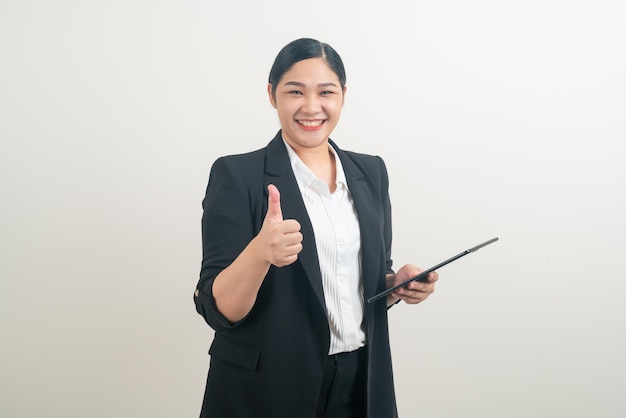 portrait Asian woman holding and using tablet with white background