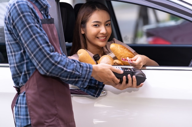 Photo portrait of asian woman make mobile payment contactless technology