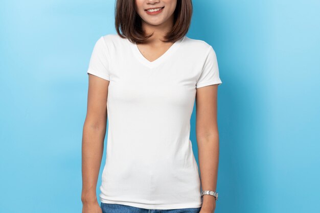 Portrait of asian woman in Mock-up blank white T-shirt on blue background