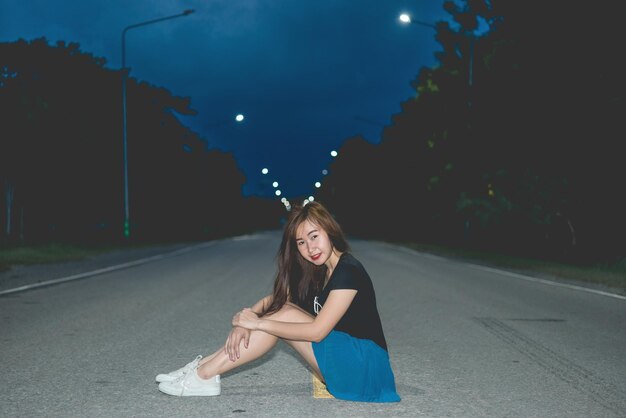 Portrait of asian woman on the road at night sceneThailand peopleLifestyle of modern girl