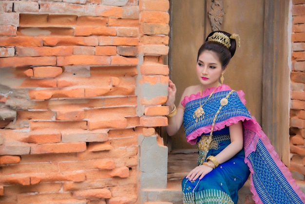 Portrait of asian woman wear ancient thai dress styleThailand people Thai traditional dress pay respect