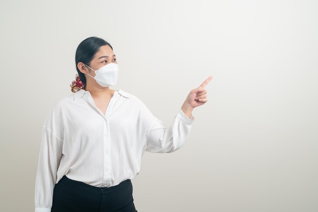 portrait Asian woman wearing mask with white background