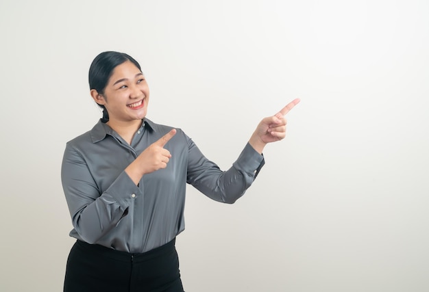 portrait Asian woman with hand pointing on white background