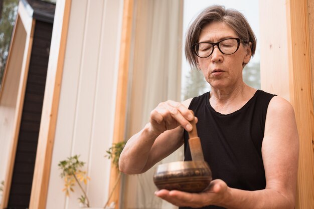 Portrait of asian woman with sound bowl