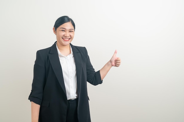 Portrait Asian woman with thumb up white background