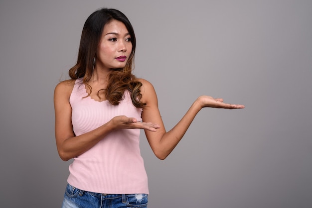 Portrait of Asian woman with wavy hair