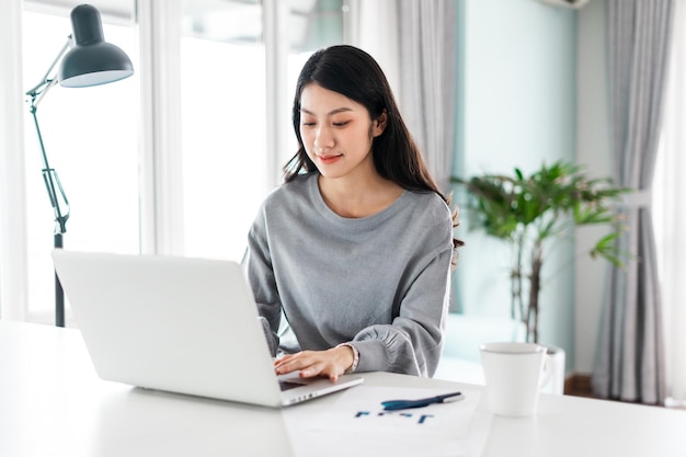 Portrait of asian woman working from home