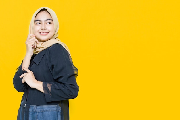 Photo portrait of asian women with happy face on yellow wall